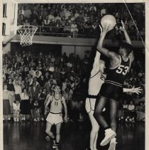 Charles Murray taking a jump shot at Hatchet gym (ca. 1952-1955)