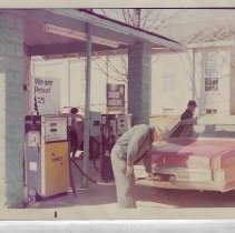 Herschel Joseph Arvin pumping gas in Alfordsville