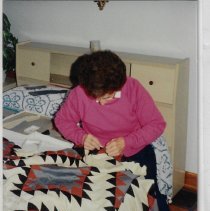 Lucille Arvin working on a quilt