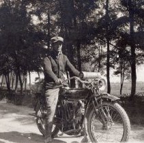 Ralph R. Feagans on a motorcycle