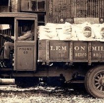 Hayden Caress driving a Lemon Milling Co. truck (ca. 1920-1930)