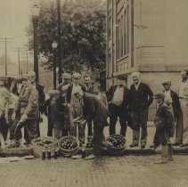 Men pouring beer down drain in Washington during Prohibition (1928)