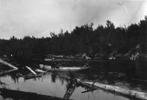 Downstream from Rest Lake dam showing erosion
