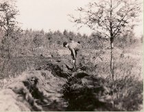 Camp Mercer crew cleaning plow line around edge of fire 1936