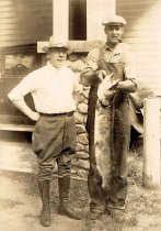 two men and large fish
