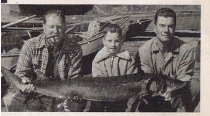 Guide John Brunner (right) with clients and fish