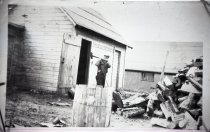 Toivo Ruha splitting wood.  ca early 1940s