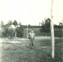 1926 Bill Waffle at the water pump at Bakken's Cottages