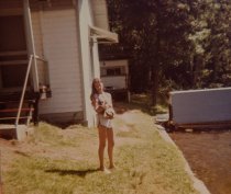 Jody Moll by duplex cabin; Lakeview cabin in back