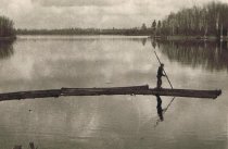 1910 Henry poling logs to build cabins at the resort