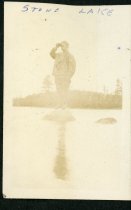 ca 1910s Standing on the rock in Stone Lake
