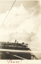 Camp enrollees up in the fire tower, looking down