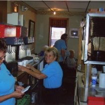 Delhi Chili workers behind counter