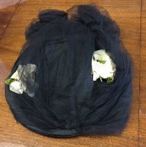 Lady's black velvet hat with two white flowers and black veil