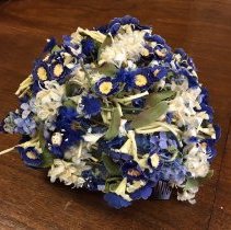 Lady's hat with blue artifical flowers
