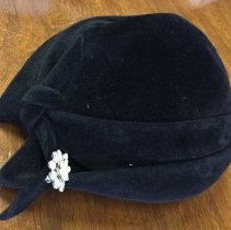 -Woman's black velvet hat with rhinestone pin, from Shillito's Department S