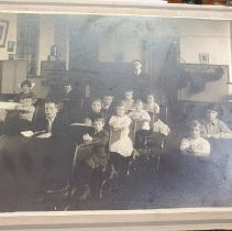Photo of students and teacher inside Myers Schoohouse, circa 1920s