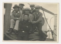 Photograph of six men on a ship