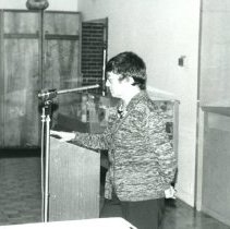 Woman speaking at podium