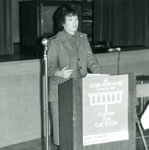 Woman speaking at podium