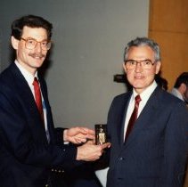 William Gitlin and Joseph Wind with award
