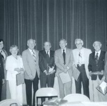 People posing with awards