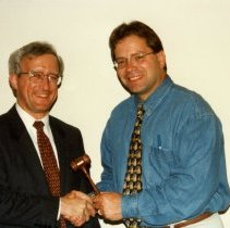 Steven Goldberg and Harvey Weingarten exchanging gavel