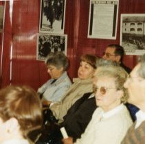 People seated listening to presentation