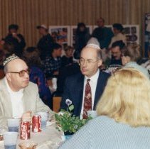 Men and women sitting indoors