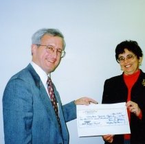 Steve Goldberg presenting check to Marilyn Gardner