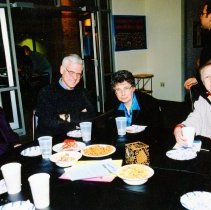 Four people sitting at table