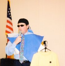 Lionel Jensen auctioning sweatshirt