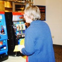 Person standing in front of slot machine