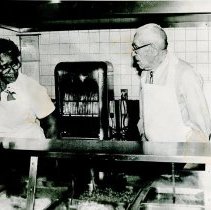 Man and women in industrial kitchen at hospital