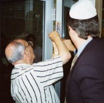 Mezuzah being placed on Federation building