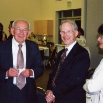 three people attending dedication of Federation building