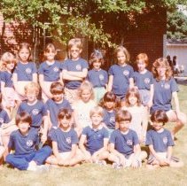 Campers posing with their counselors outdoors