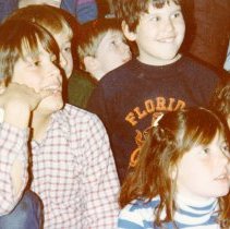 Children smiling and listeneing