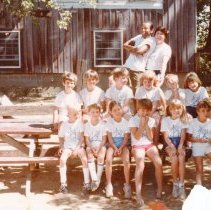 "Space Invader" campers and counselors posing at picnic table