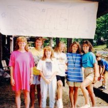 Counselors posing under Israel banner