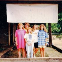 Counselors standing under an Israel banner