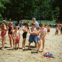 Children standing on beach.