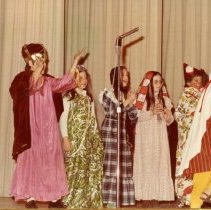 Hebrew School children performing in colorful costumes for Purim party