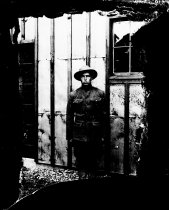 Soldier in front of building