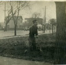 Unlabeled picture of a firefighter and a young girl shoveling dirt
