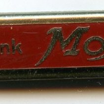 Front side: "Drink Moxie," with opener extended