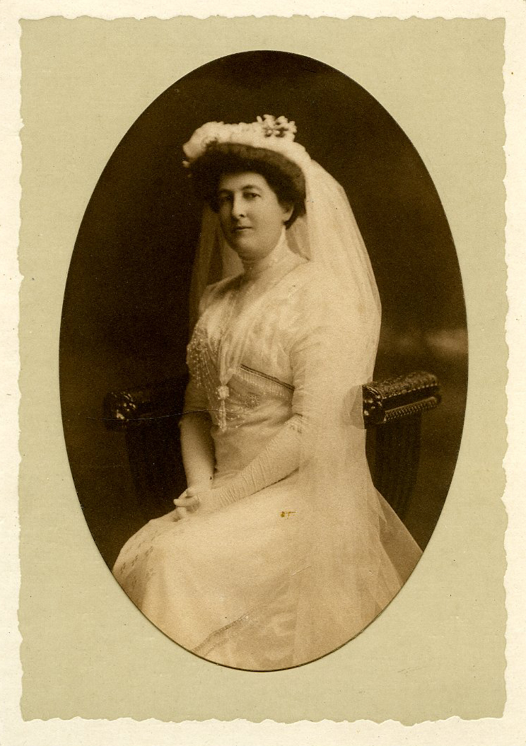 A sepia-toned wedding photograph of Mary Florence Hyde Goodrich Speare seated in a chair.