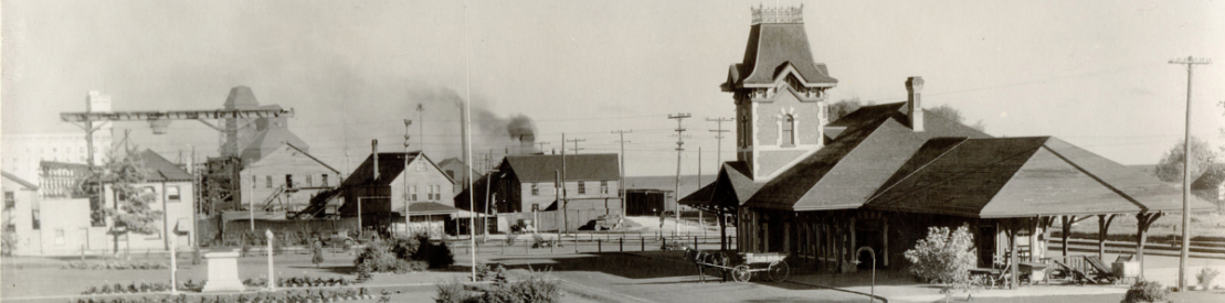 Collingwood Train Station, looking west north towards Collingwood Harbour with Collingwood Terminals and shipbuilding structures showing along Huron Street.