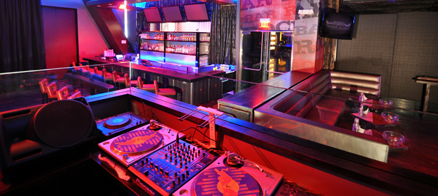 Picture of bar with DJ