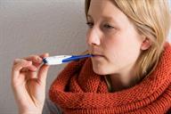 A person taking their temperature by mouth.